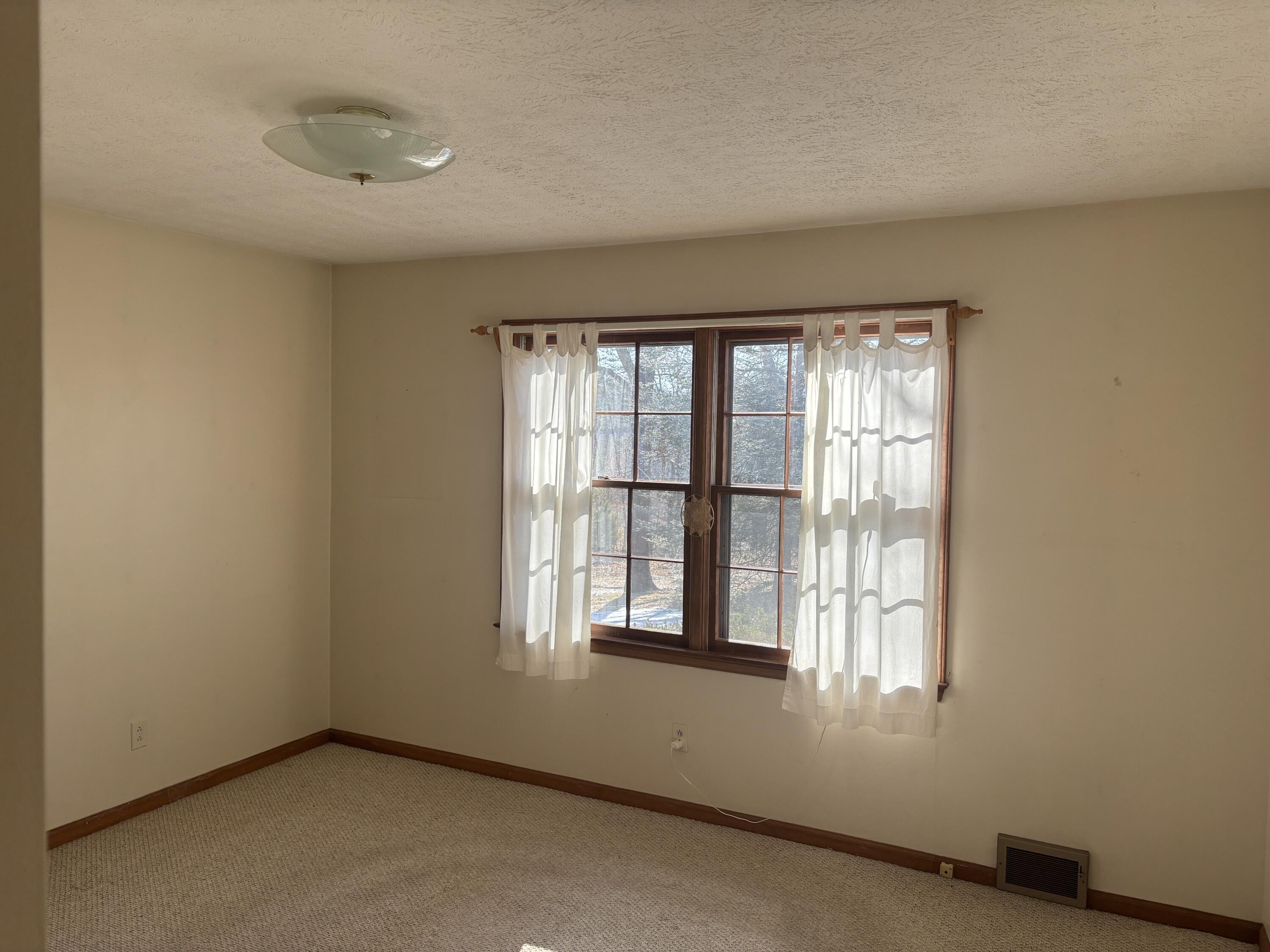 1115 Robin Ridge Road Henry, VA 24102 - Photo 21 of 30 an empty room with a window
