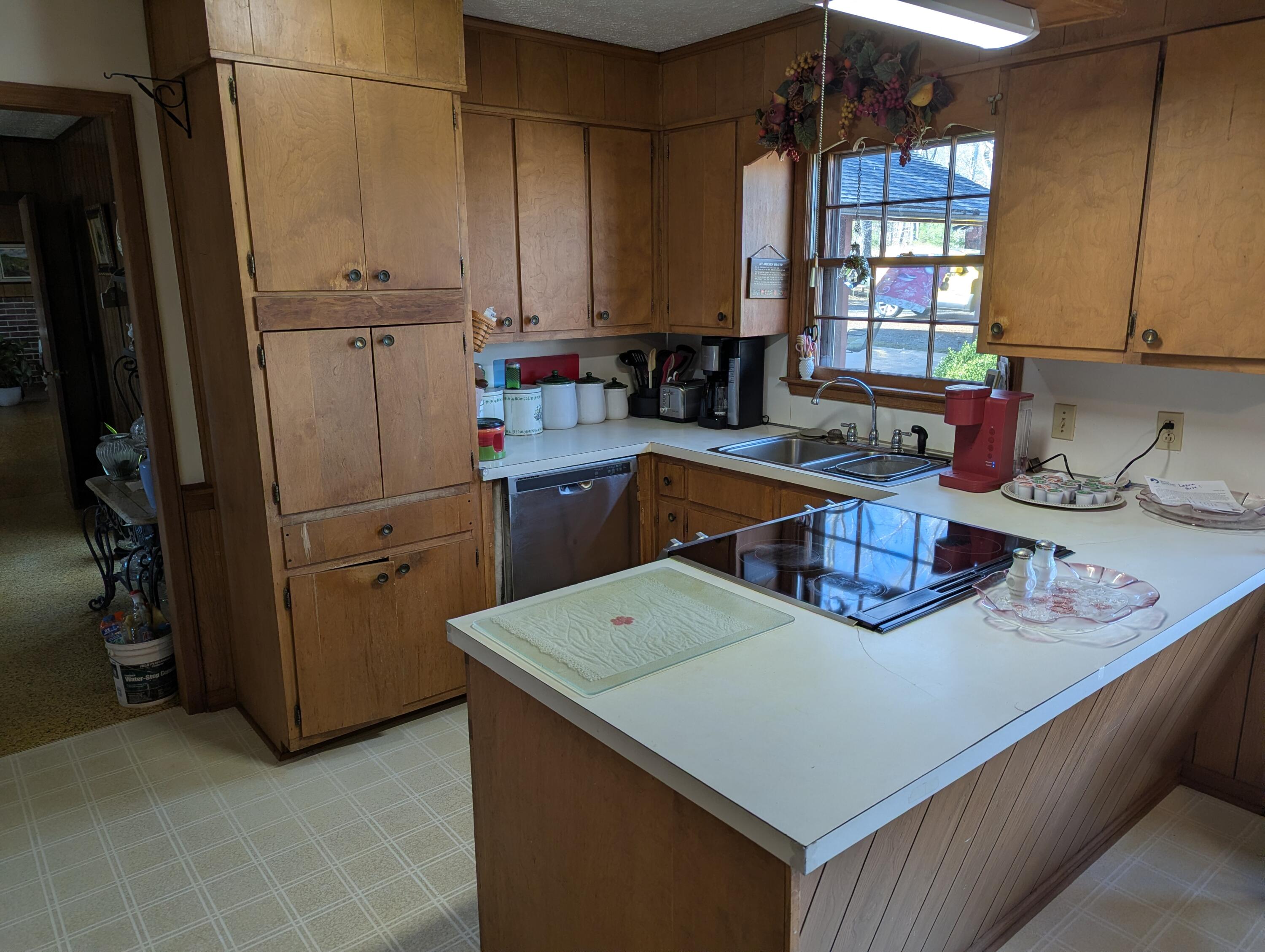 1115 Robin Ridge Road Henry, VA 24102 - Photo 22 of 59 a kitchen with refrigerator and cabinets