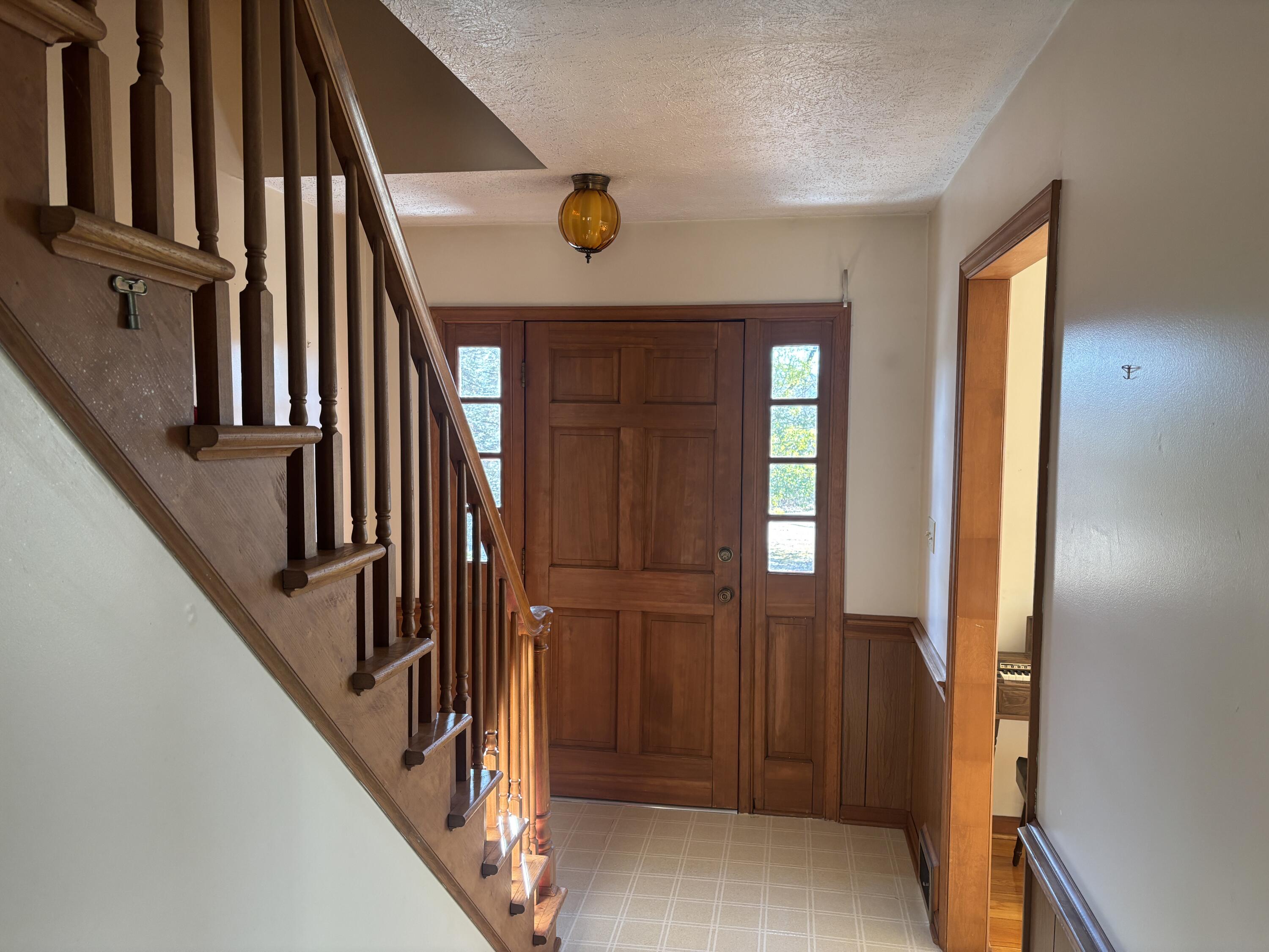 1115 Robin Ridge Road Henry, VA 24102 - Photo 22 of 30 an entryway with wooden floor and stairs