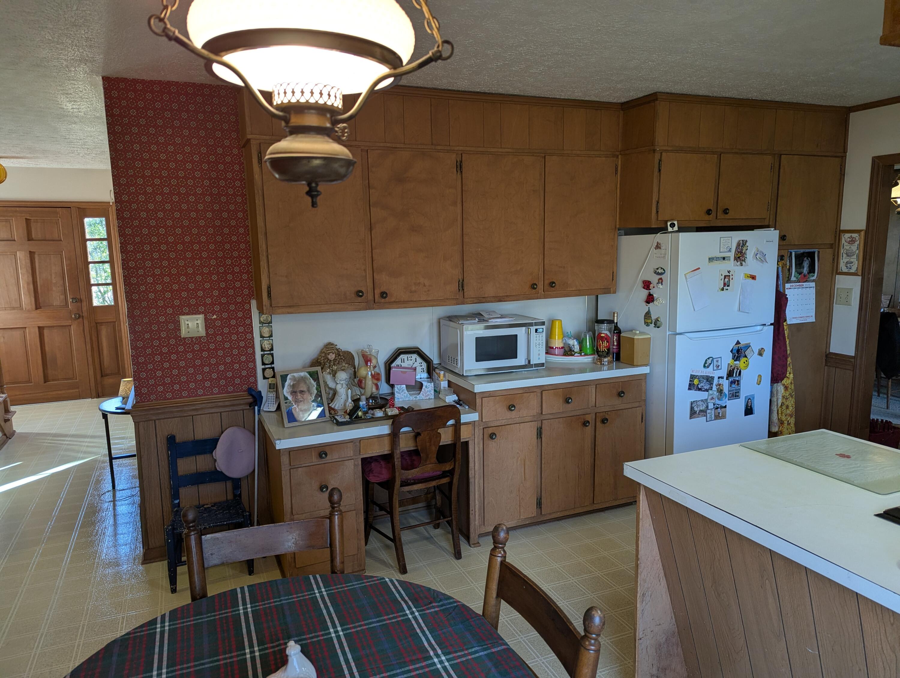 1115 Robin Ridge Road Henry, VA 24102 - Photo 25 of 59 a kitchen with a refrigerator and table chairs