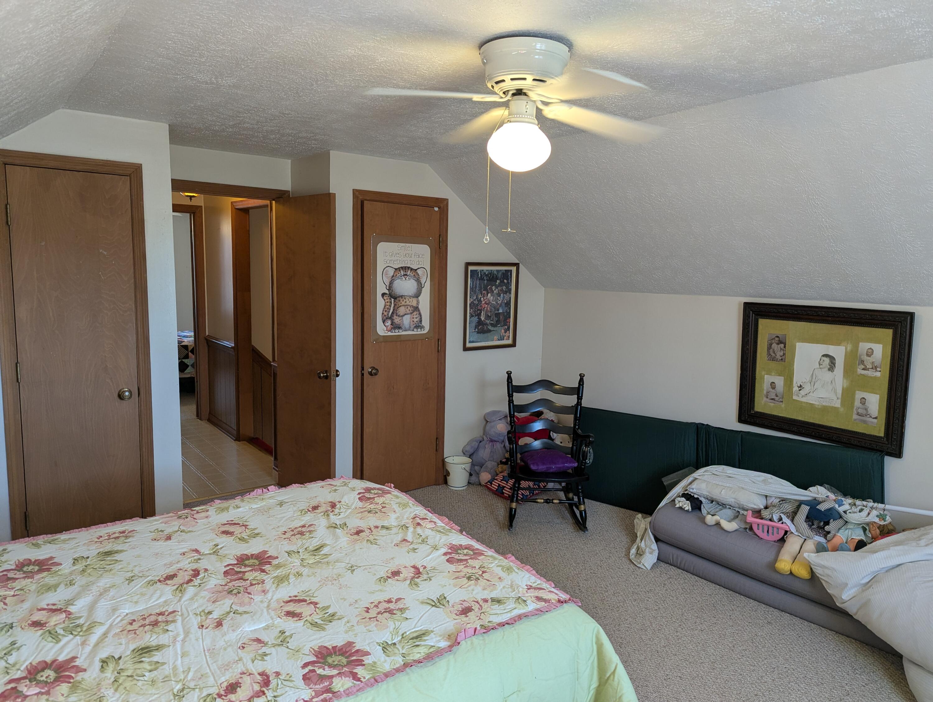 1115 Robin Ridge Road Henry, VA 24102 - Photo 27 of 59 a bedroom with bed and a chandelier