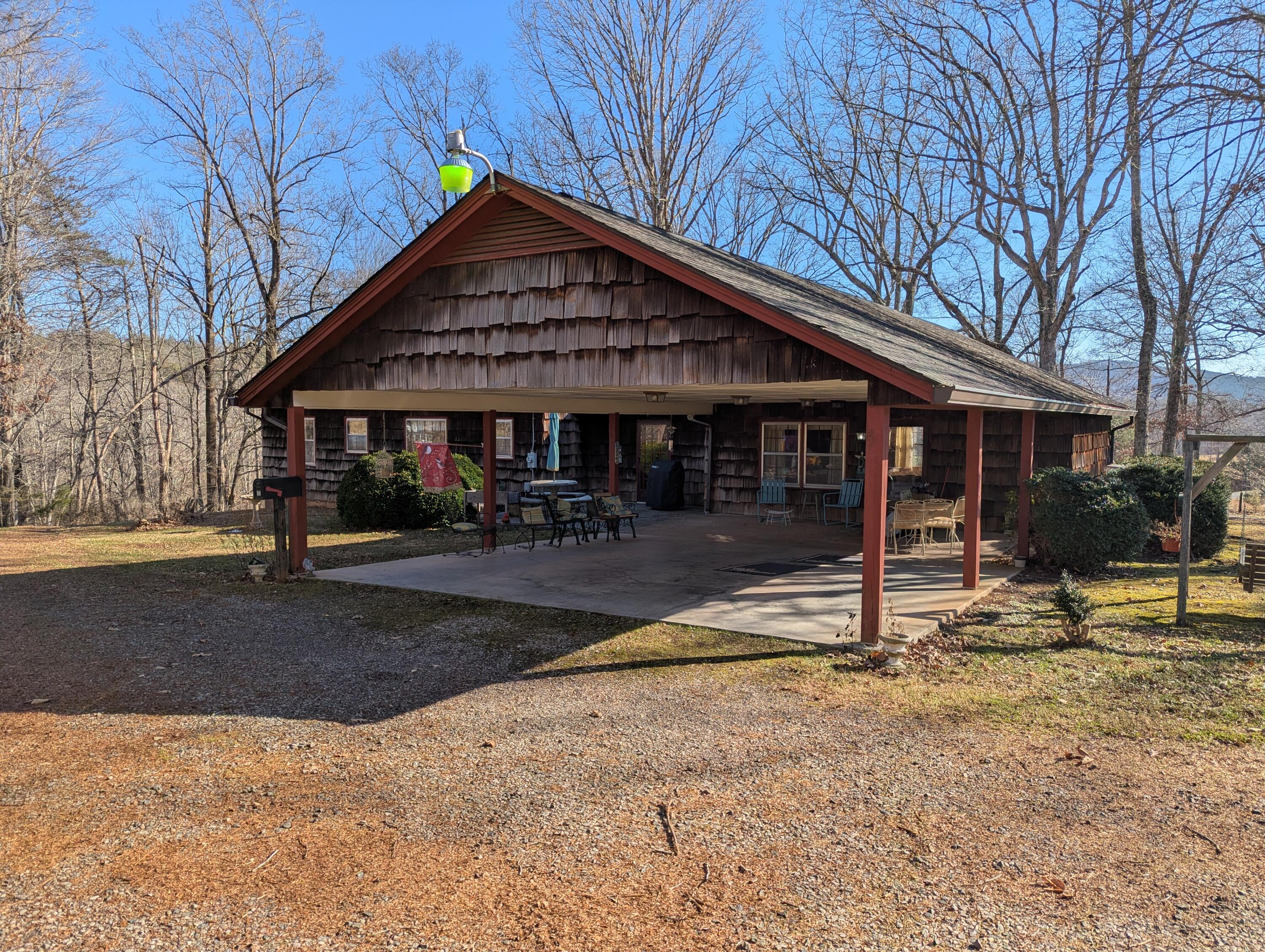 1115 Robin Ridge Road Henry, VA 24102 - Photo 34 of 59 a front view of a house with garden