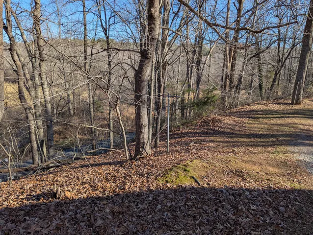 a kitchen with a stove window and cabinets