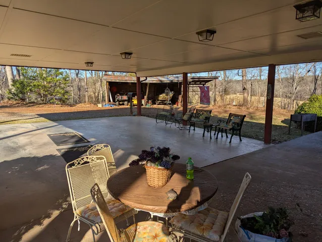 a bathroom with a sink a toilet a tub and a window