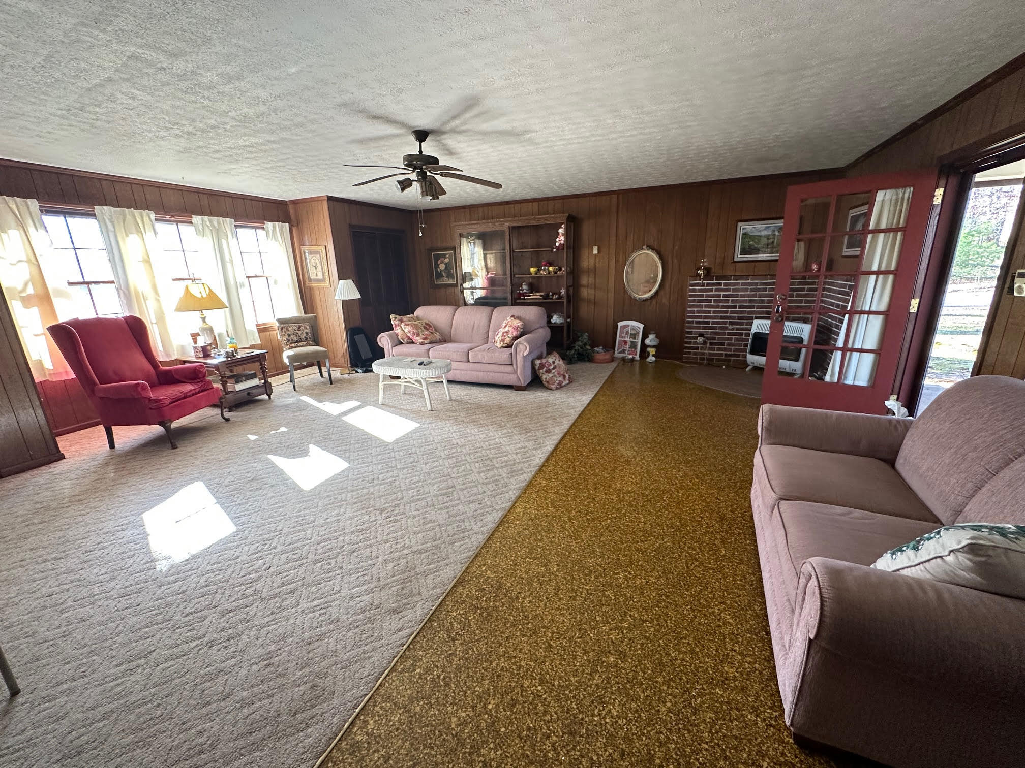 1115 Robin Ridge Road Henry, VA 24102 - Photo 48 of 59 a living room with furniture a fireplace and a large window