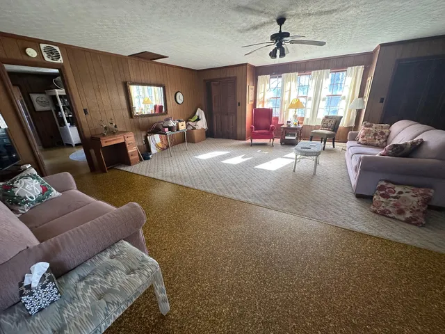 a view of a dining room with furniture and window