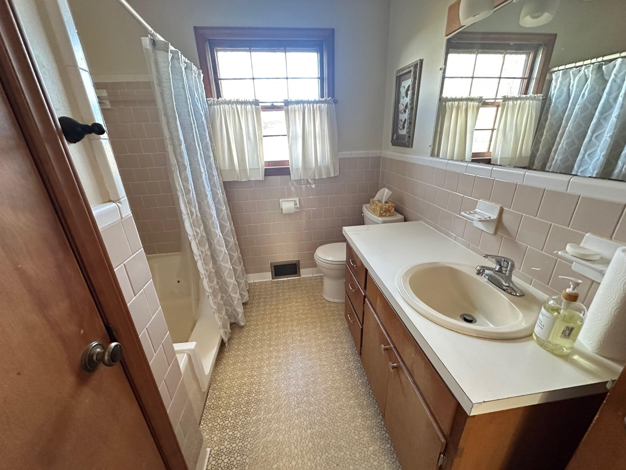 1115 Robin Ridge Road Henry, VA 24102 - Photo 53 of 59 a bathroom with a sink a toilet a tub and a window