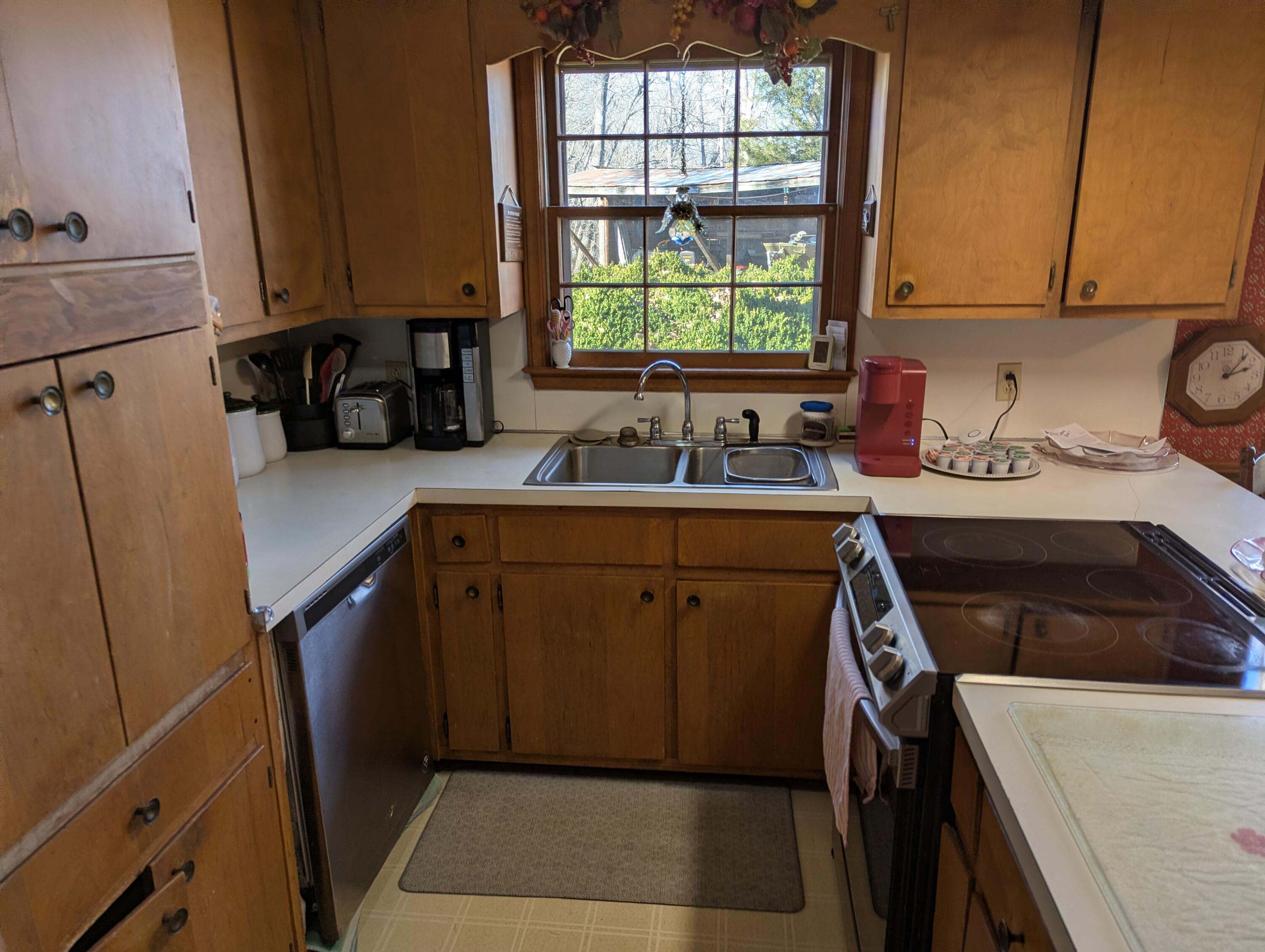 1115 Robin Ridge Road Henry, VA 24102 - Photo 7 of 30 a kitchen with a sink cabinets and window