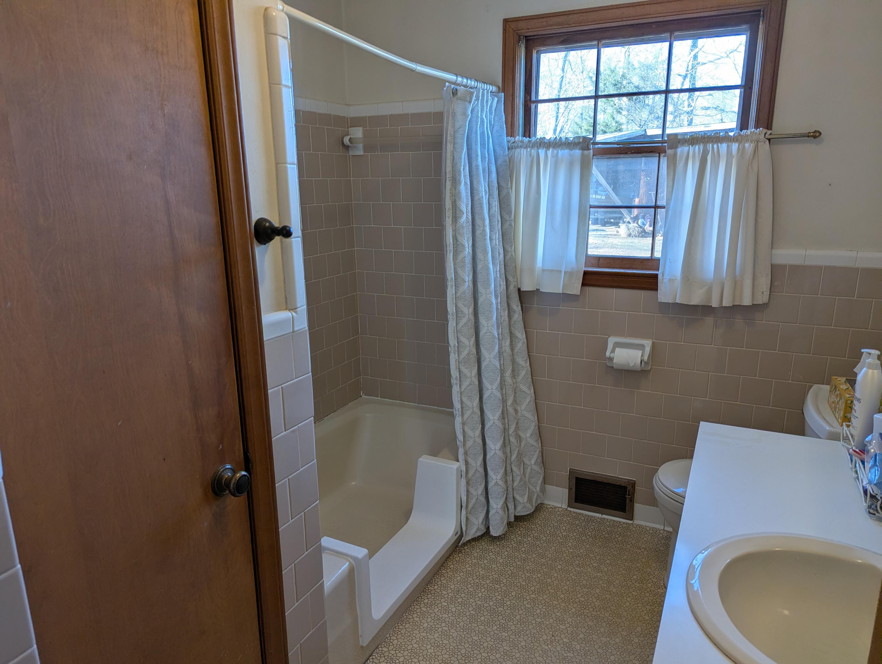 1115 Robin Ridge Road Henry, VA 24102 - Photo 9 of 59 a bathroom with a sink toilet and shower