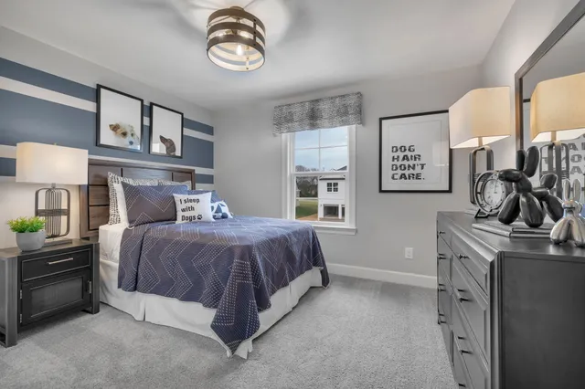 a bedroom with a bed and a table in it