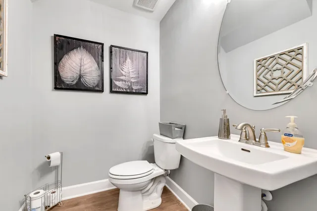 a bathroom with a toilet and a sink
