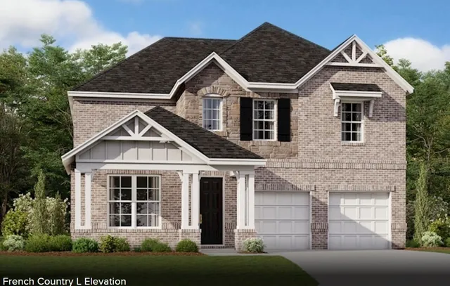 a view of a white house next to a yard