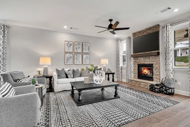 a living room with furniture and a fireplace