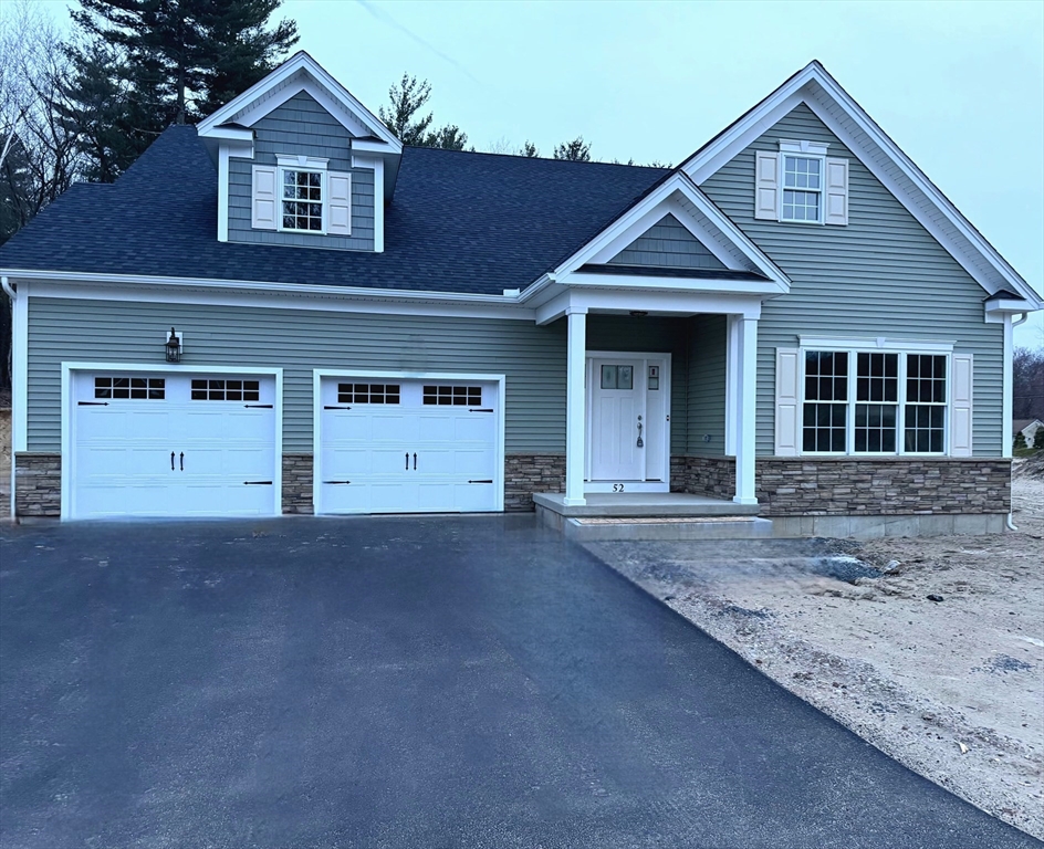 46 Liberty Lane Enfield, CT 06082 - Photo 1 of 4 a front view of a house with a yard and garage