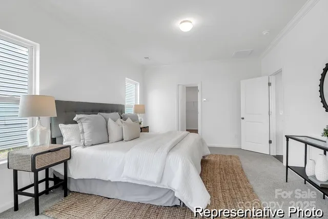 a bedroom with a bed and a night stand