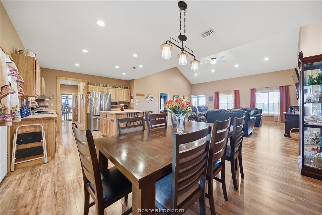 126 South Berlin Road Brenham, TX 77833 - Photo 11 of 30 a view of a dining area with furniture and wooden floor