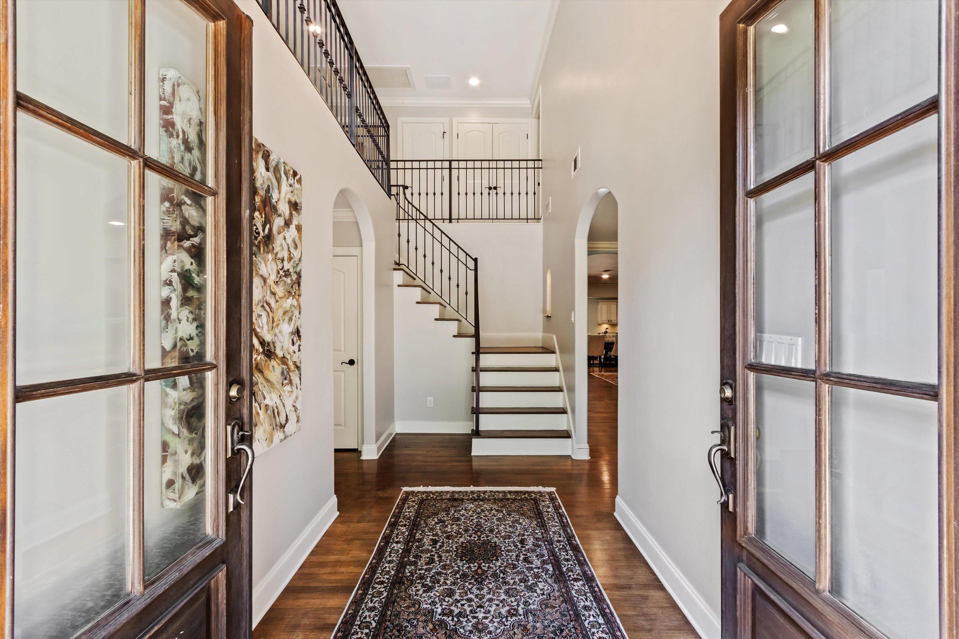 5302 South Angela Road Memphis, TN 38120 - Photo 2 of 40 Double-leaf entry doors with clear glass panels open to a foyer featuring hardwood flooring