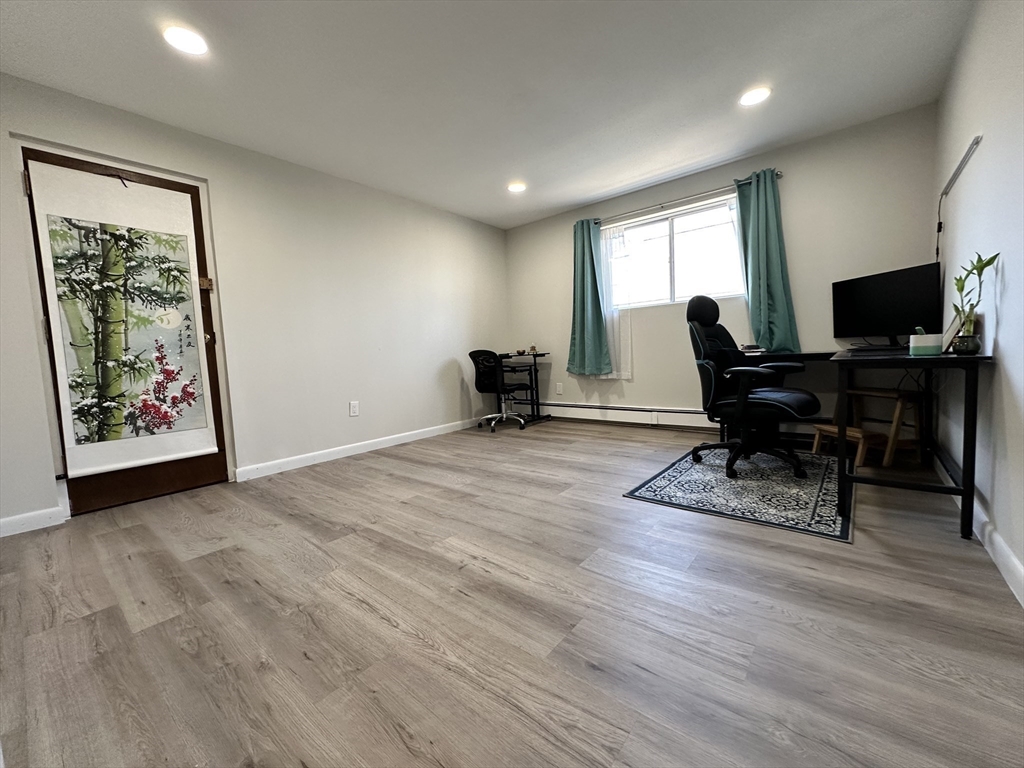 73 Charlesbank Road, Unit 306 Newton, MA 02458 - Photo 7 of 11 a view of a workspace with furniture and a window