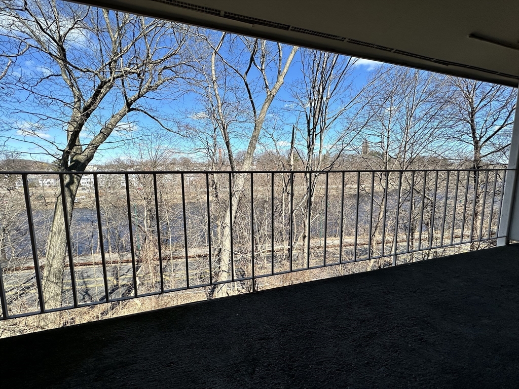 73 Charlesbank Road, Unit 306 Newton, MA 02458 - Photo 9 of 11 a view of a street view from window