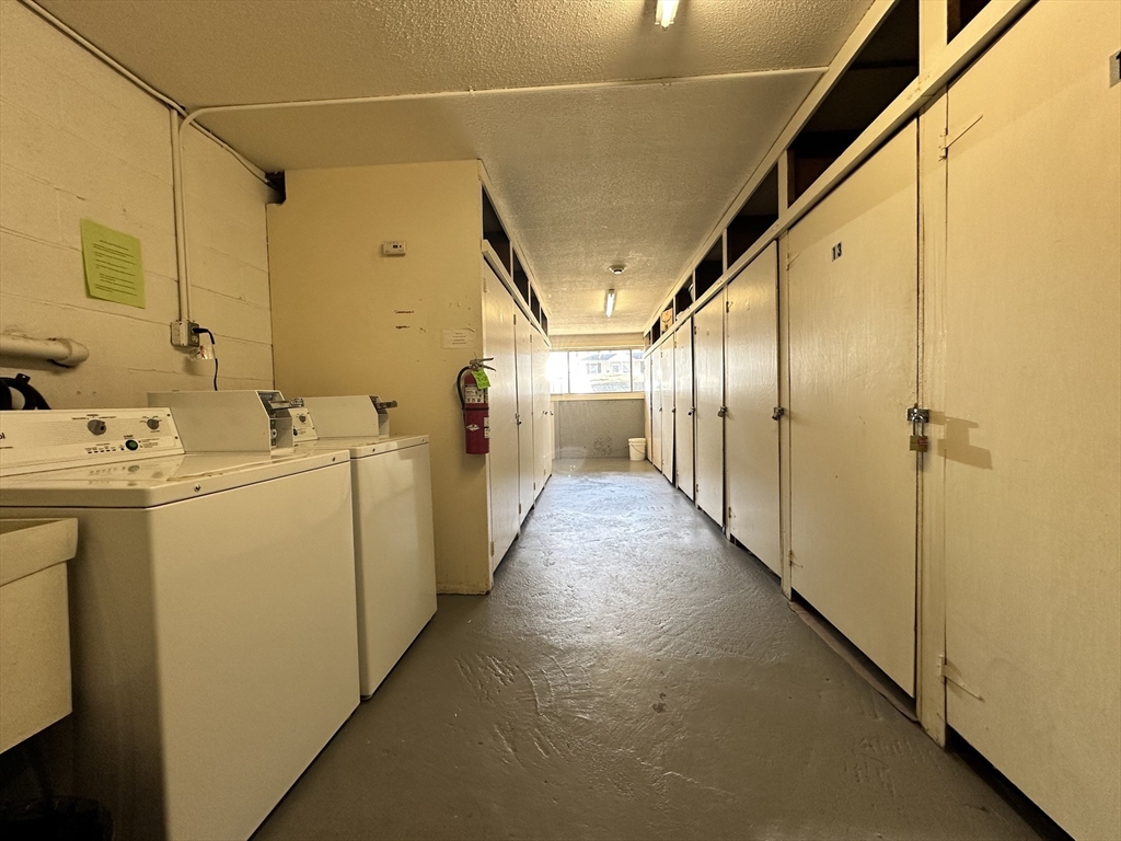 73 Charlesbank Road, Unit 306 Newton, MA 02458 - Photo 10 of 11 a utility room with dryer and washer