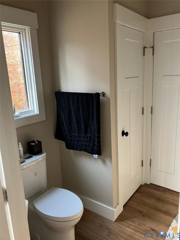 33051 Walnut Grove Farm Lane Hanover, VA 23069 - Photo 36 of 50 a white toilet sitting next to a bathroom sink