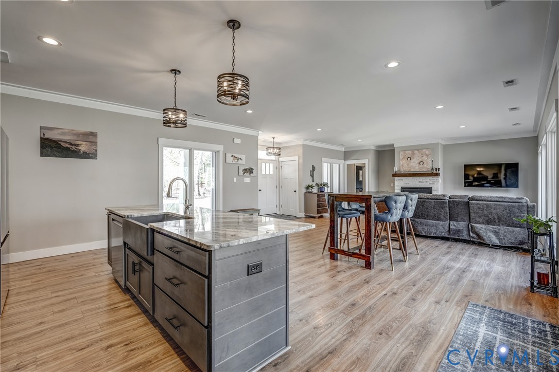 33051 Walnut Grove Farm Lane Hanover, VA 23069 - Photo 39 of 76 a kitchen with stainless steel appliances granite countertop lots of counter top and wooden floor