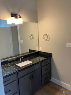 33051 Walnut Grove Farm Lane Hanover, VA 23069 - Photo 42 of 50 a bathroom with a granite countertop sink and a mirror