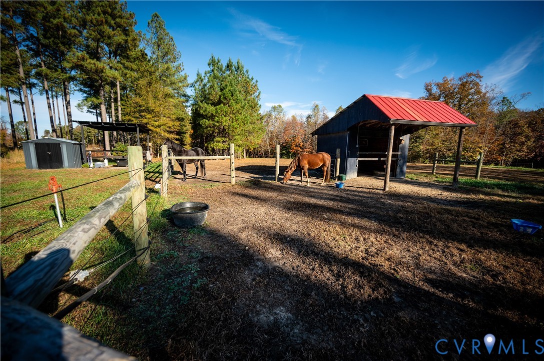 33051 Walnut Grove Farm Lane Hanover, VA 23069 - Photo 6 of 50 a view of a house with backyard and sitting area