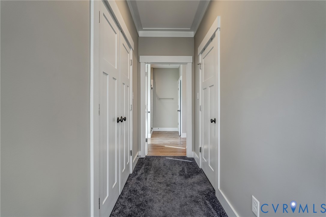 33051 Walnut Grove Farm Lane Hanover, VA 23069 - Photo 61 of 76 a view of a hallway with a wooden door