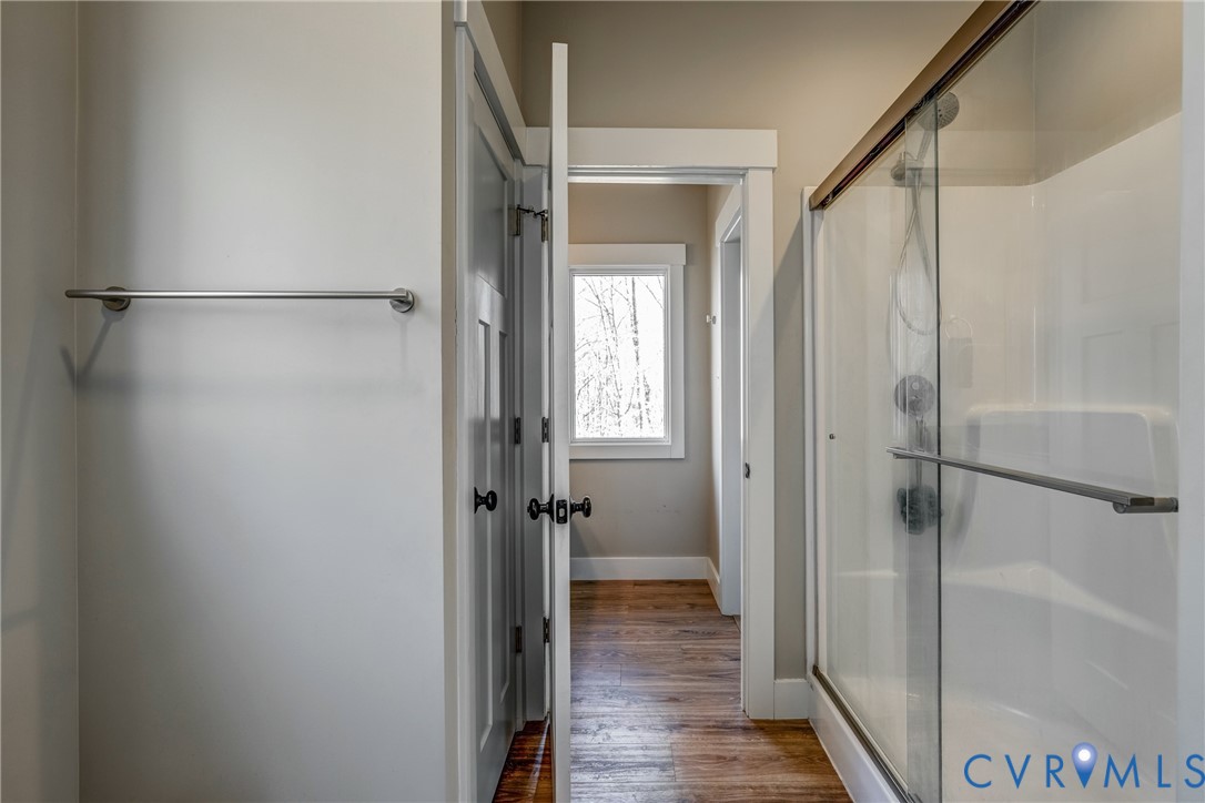 33051 Walnut Grove Farm Lane Hanover, VA 23069 - Photo 70 of 76 a bathroom with a shower and a glass door