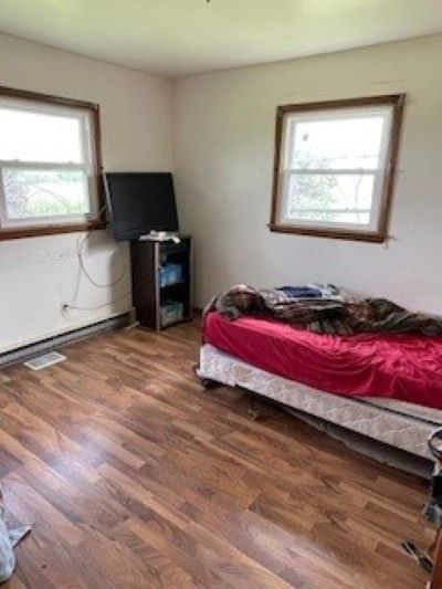 12257 Waterman Road Waterman, IL 60556 - Photo 14 of 22 a bedroom with a bed and a window