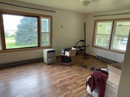 12257 Waterman Road Waterman, IL 60556 - Photo 15 of 22 a room with window and wooden floor