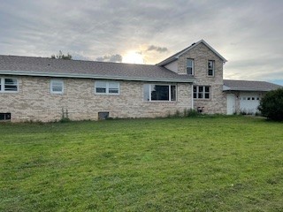 12257 Waterman Road Waterman, IL 60556 - Photo 3 of 22 a front view of house with yard and green space