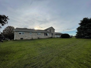 12257 Waterman Road Waterman, IL 60556 - Photo 4 of 22 a view of a house with a big yard