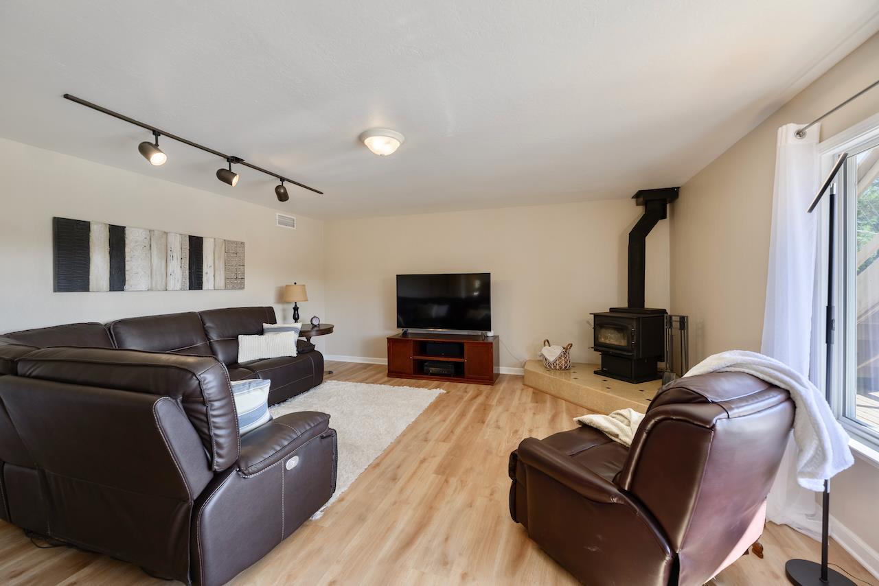 155 Rabbits Run Road Santa Cruz, CA 95060 - Photo 70 of 113 a living room with furniture and a flat screen tv