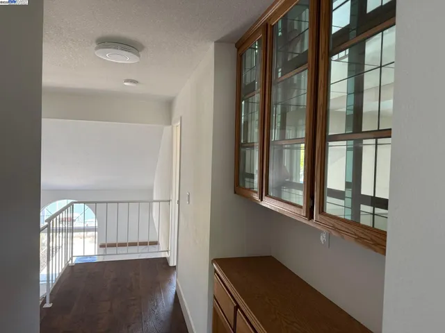 a view of an entryway with wooden floor
