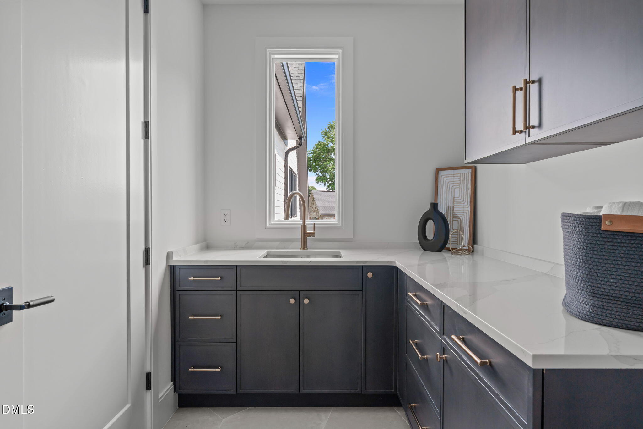 7917 South Bridgewater Court Raleigh, NC 27615 - Photo 61 of 67 a kitchen with a sink and wooden cabinets