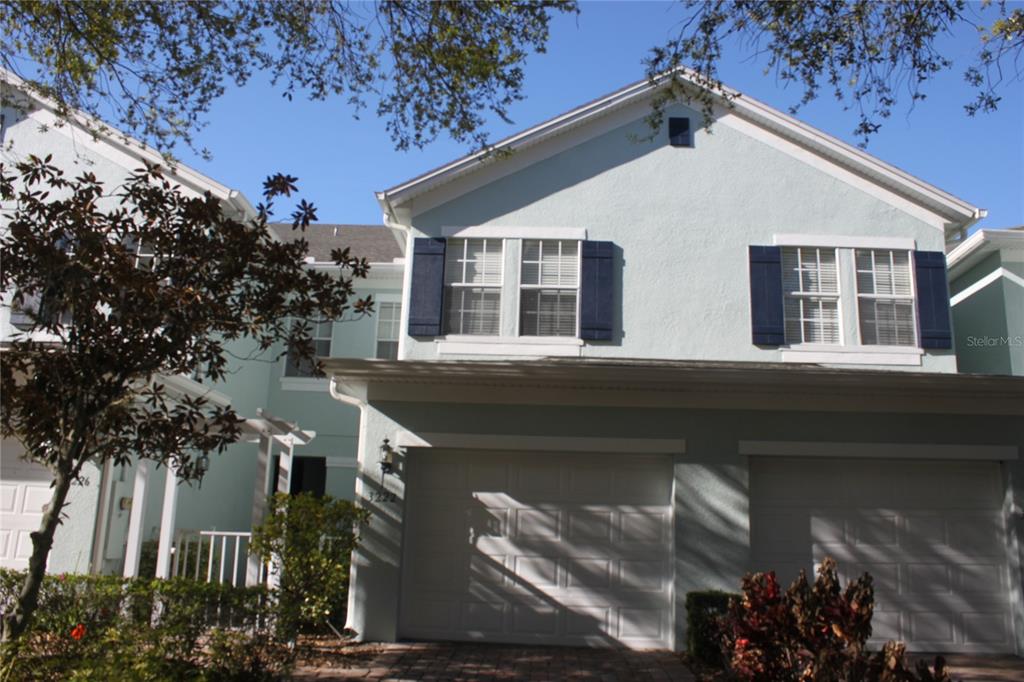a view of a house with a tree