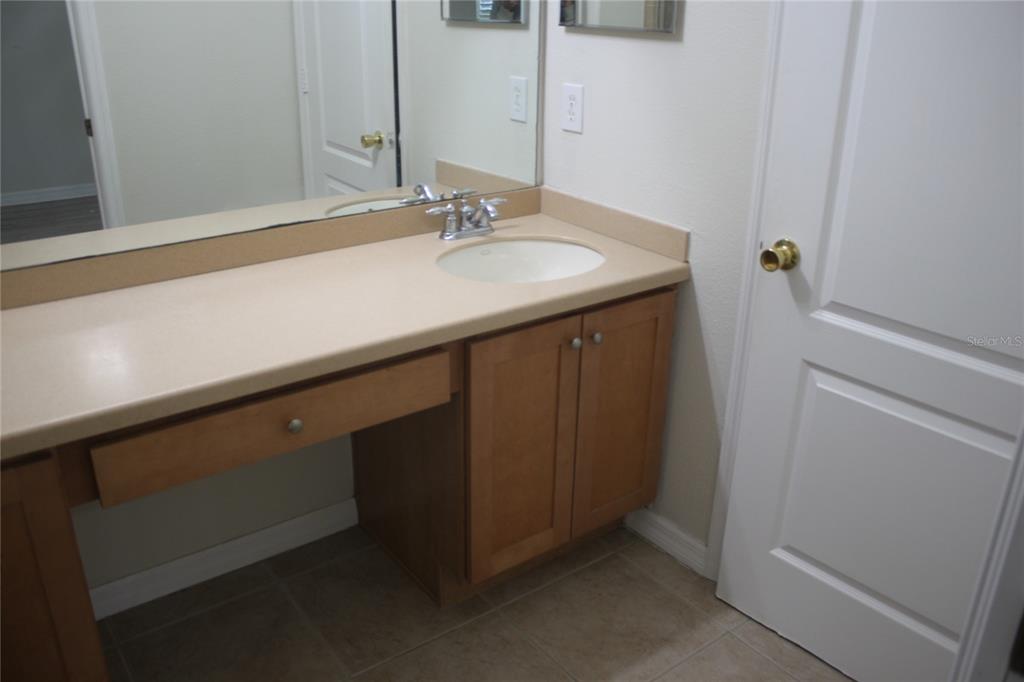 3222 Villa Strada Way Orlando, FL 32835 - Photo 15 of 26 a bathroom with a sink and a mirror