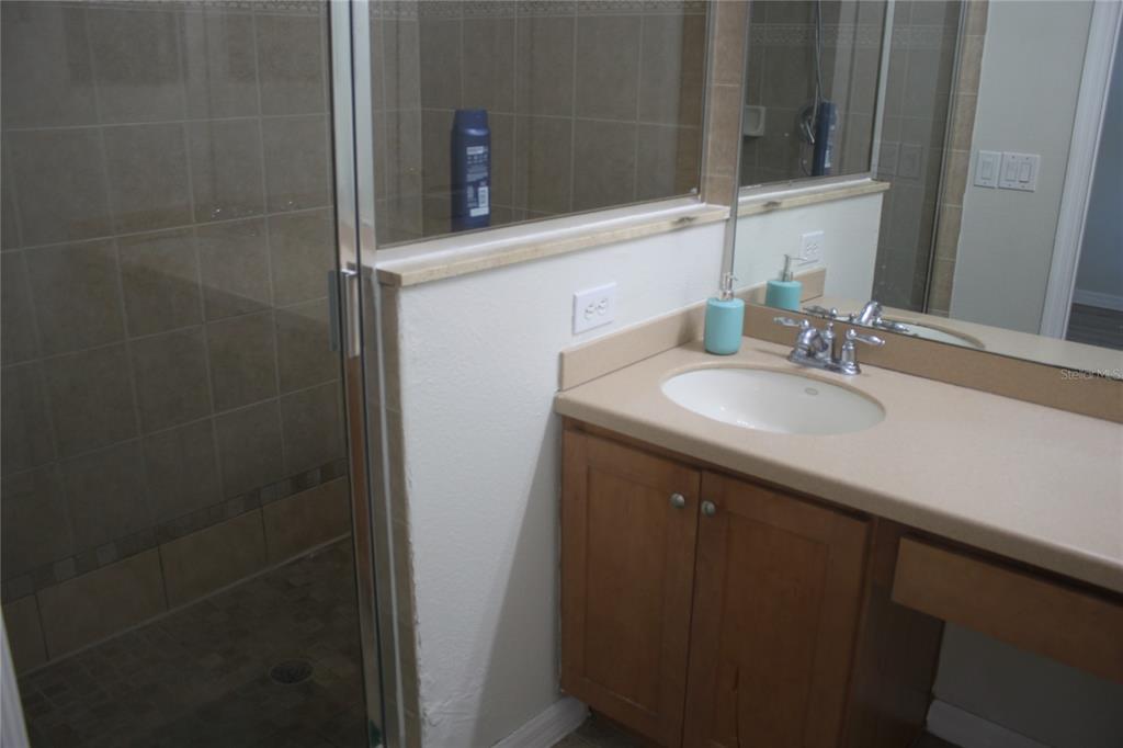 3222 Villa Strada Way Orlando, FL 32835 - Photo 16 of 26 a bathroom with a sink and a mirror