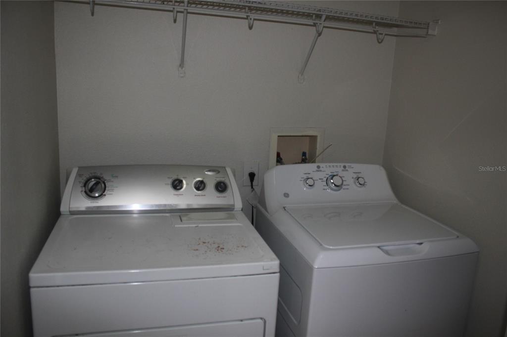 3222 Villa Strada Way Orlando, FL 32835 - Photo 18 of 26 a utility room with dryer and washer