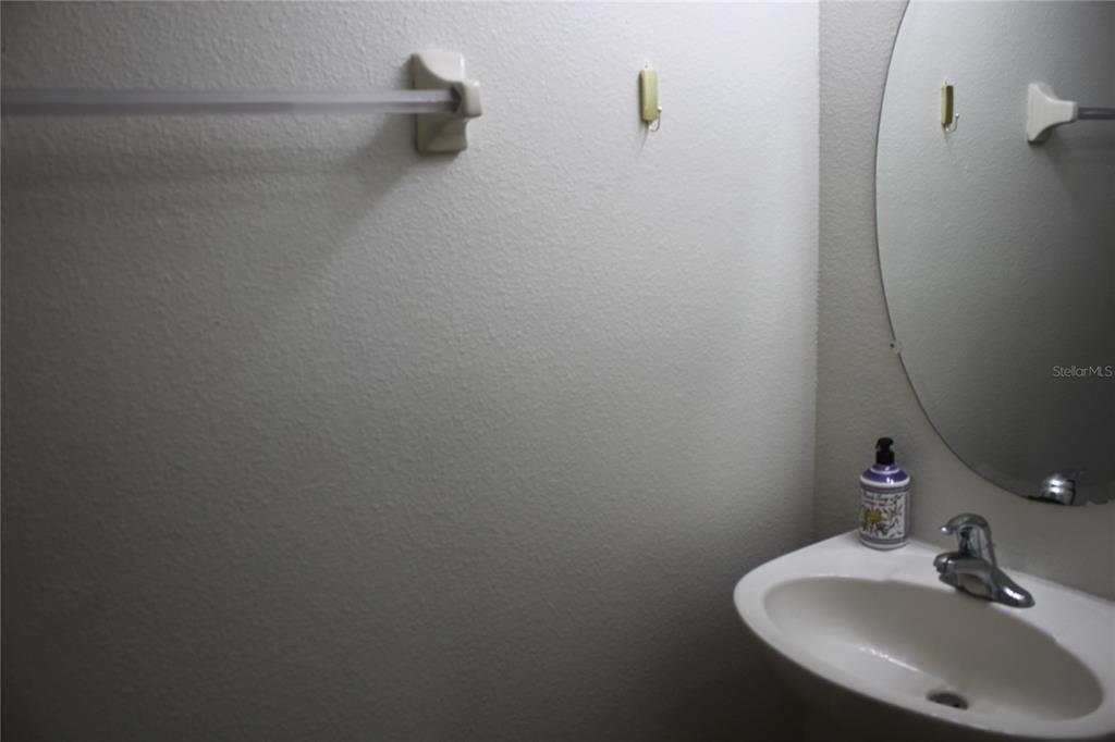 3222 Villa Strada Way Orlando, FL 32835 - Photo 4 of 26 a bathroom with a sink and a mirror