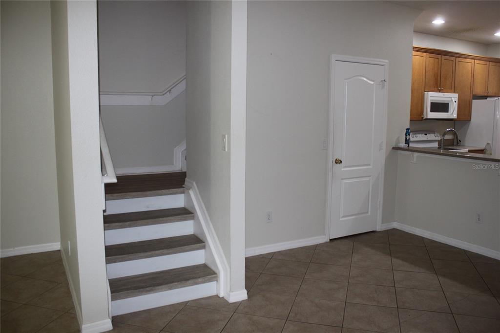 3222 Villa Strada Way Orlando, FL 32835 - Photo 8 of 26 a view of a kitchen with wooden floor and a sink
