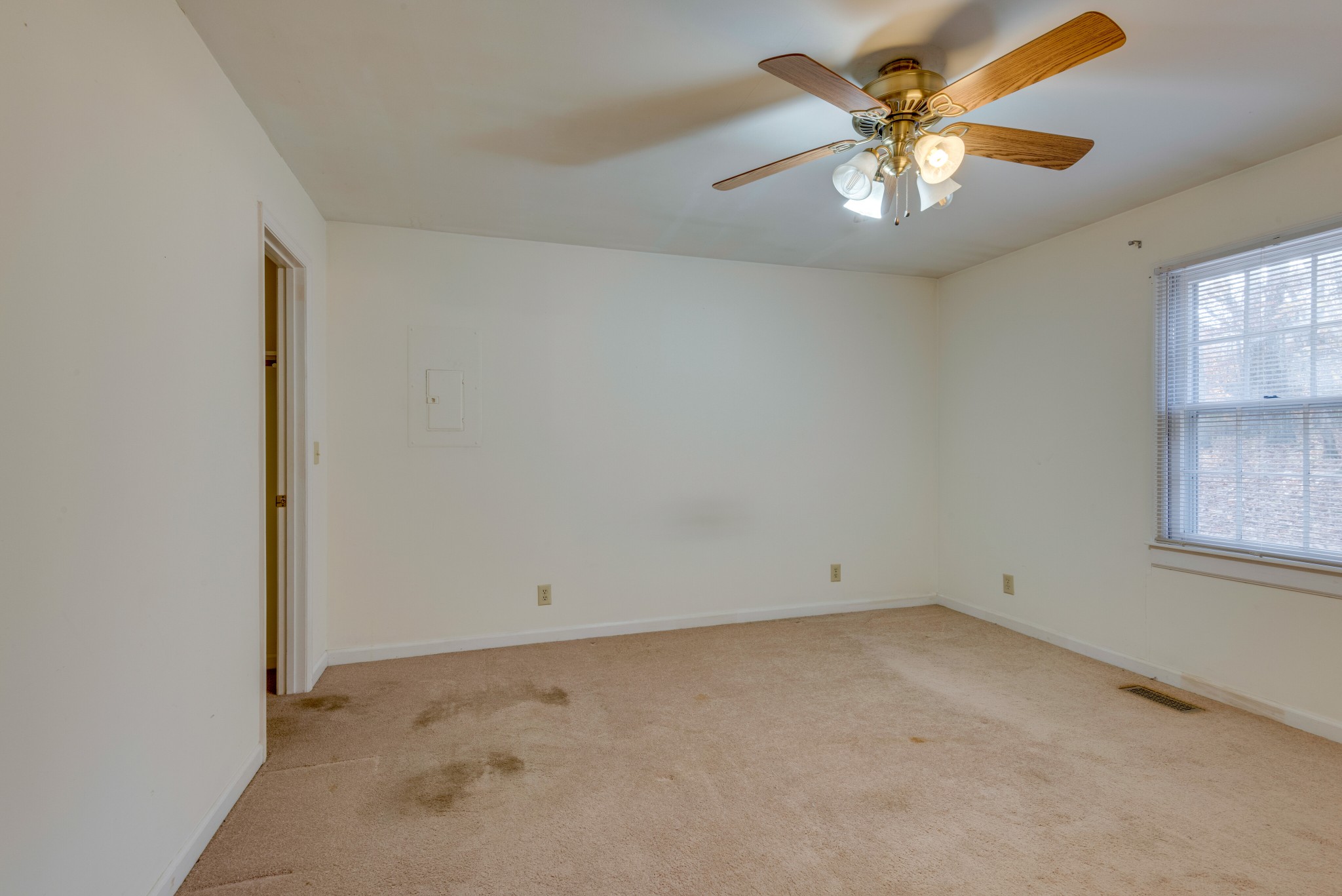 240 East Piney Road Dickson, TN 37055 - Photo 14 of 24 an empty room with windows and chandelier fan