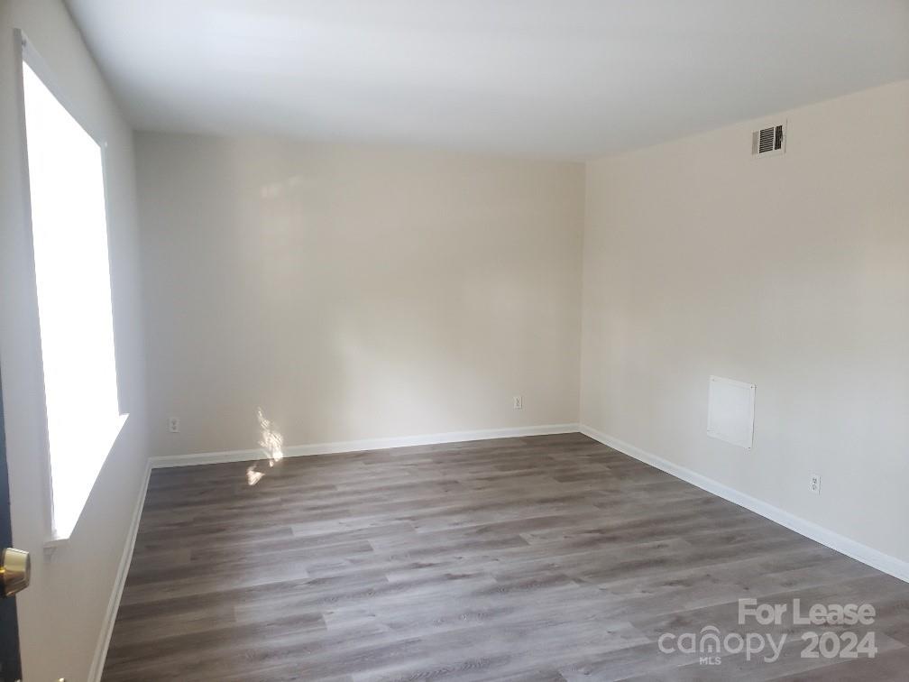 5808 Hunting Ridge Lane Charlotte, NC 28212 - Photo 2 of 6 a view of an empty room and wooden floor