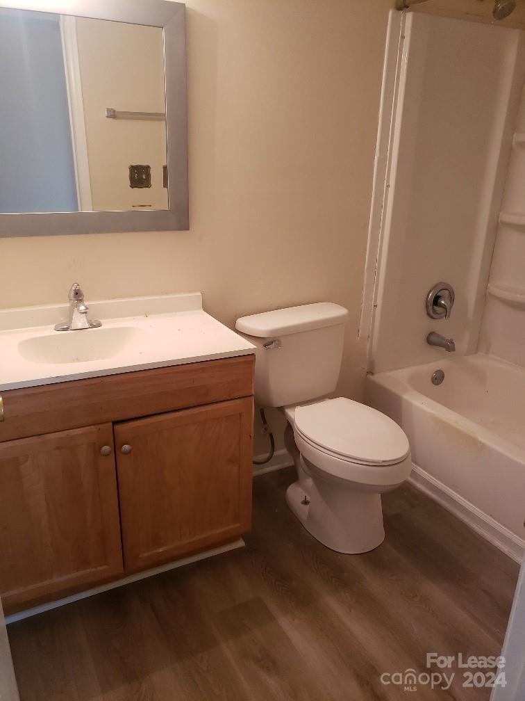 5808 Hunting Ridge Lane Charlotte, NC 28212 - Photo 4 of 6 a bathroom with a sink a toilet and shower