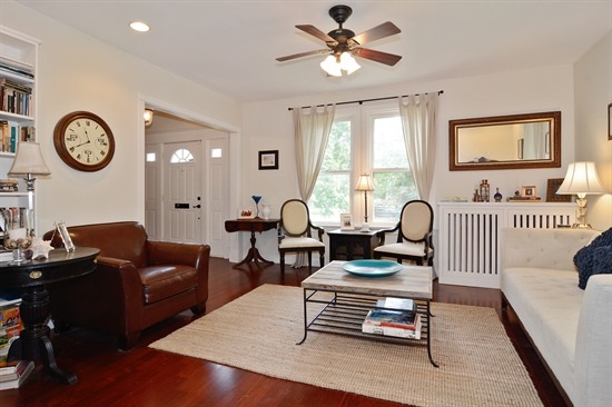 250 Lawton Road Riverside, IL 60546 - Photo 3 of 25 a living room with furniture a chandelier fan and a window