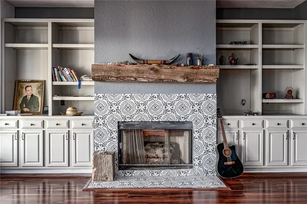 a living room with furniture and a fireplace