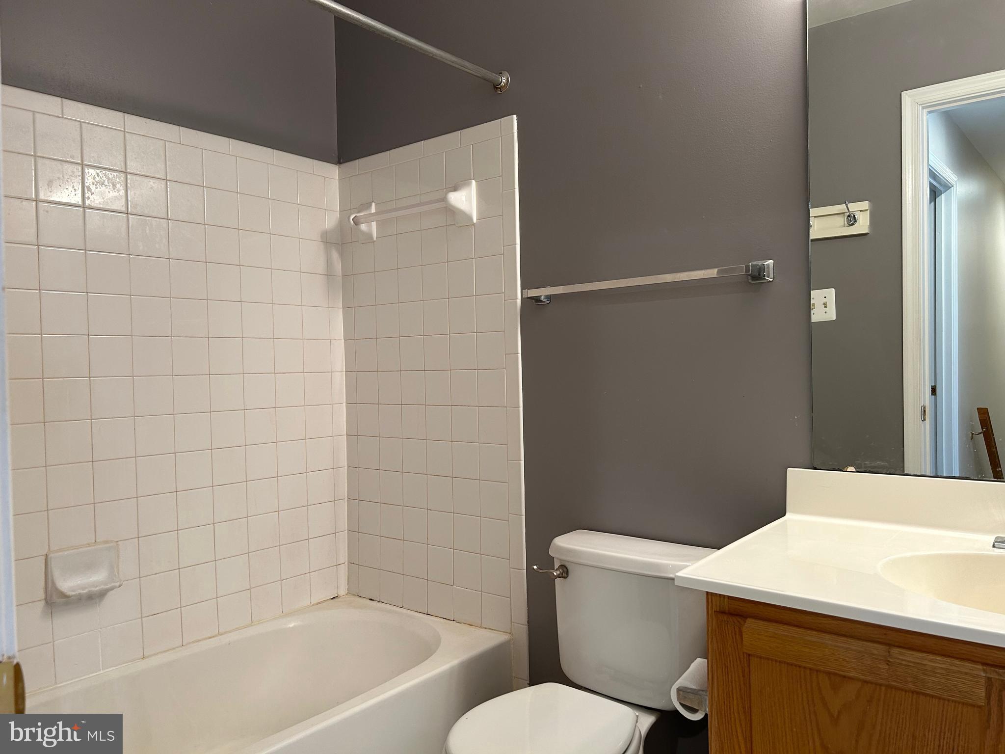 55 Alexis Drive Newark, DE 19702 - Photo 19 of 27 a bathroom with a sink a toilet and shower