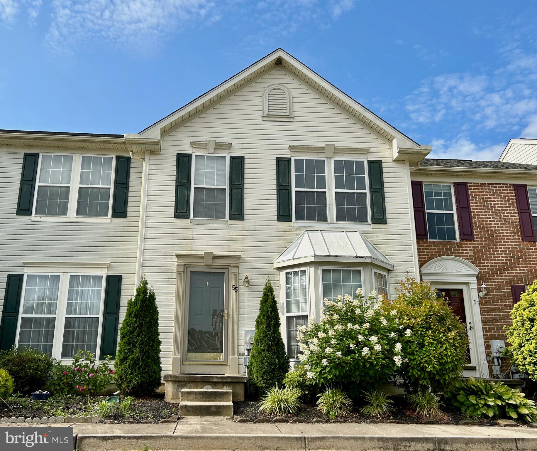 55 Alexis Drive Newark, DE 19702 - Photo 2 of 27 a front view of a house with a yard